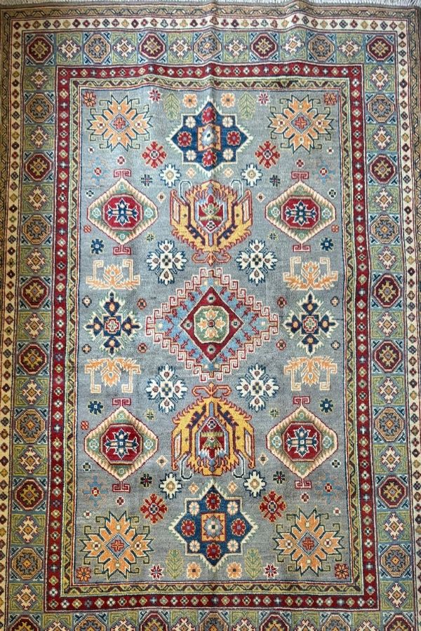 The 6.7' x 5' Qazaq Hand-Knotted Rug