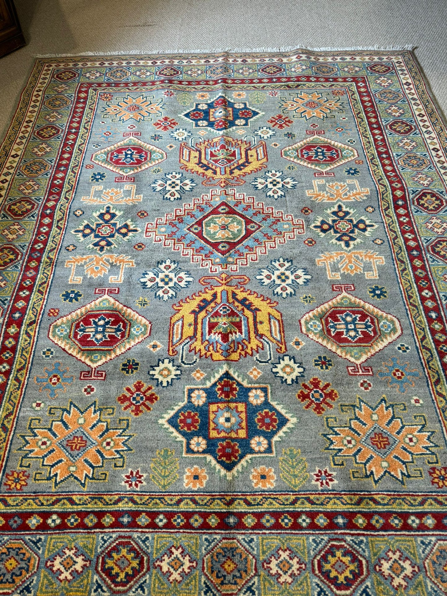 The 6.7' x 5' Qazaq Hand-Knotted Rug